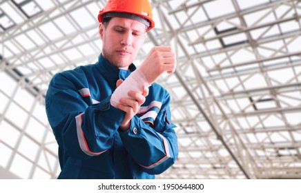 Male Industrial Worker In Uniform With Bandage, Accident Injury, First Aid Help