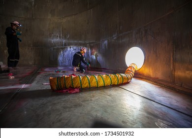 Male Into Work Inspection Process Chemical Color Paint  Weld Cleaning Red At The With Stainless Steel  Blower Fresh Air Into Oil Storage Tank Confined Space