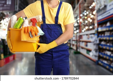 Male Janitor With Cleaning Supplies In Shopping Mall, Closeup