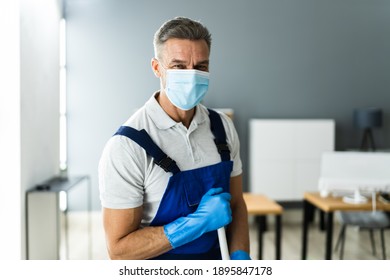 Male Janitor Mopping Floor In Face Mask In Office - Powered by Shutterstock