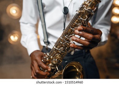 Male Jazz Performer Plays The Saxophone On Stage