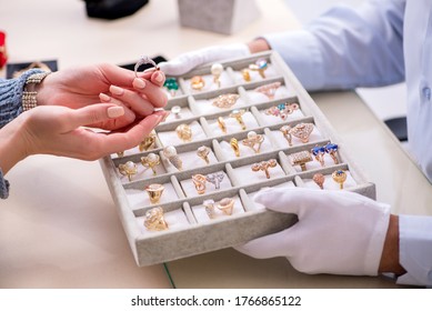 Male jeweler and female client at store - Powered by Shutterstock