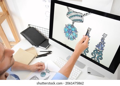 Male Jewelry Designer Working In Office