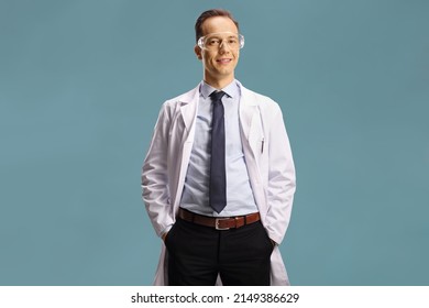 Male Laboratory Worker With Protective Goggles Isolated On Blue Background