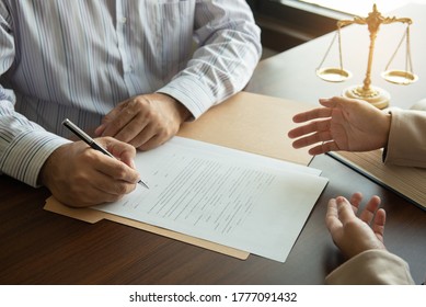 male lawyer or attorney team meeting with client in lawyer's office. law and legal judge consult concept.