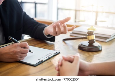 Male lawyer or judge consult having team meeting with client, Law and Legal services concept.