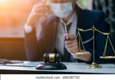 Male Lawyer Or Judge Wearing  Protective Mask On The Consult Having Team Meeting With Client, Law And Legal Services Concept