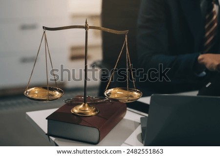Male lawyer working with contract papers and wooden gavel on tabel in courtroom. justice and law ,attorney, court judge, concept.