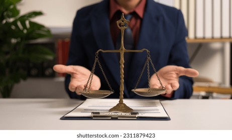 Male lawyer working with law book, A legal binding, Unilateral contract, Multilateral, Non-reciprocal contract, Default, Obligation, Power of attorney, Defense of a prescription, Court decree - Shutterstock ID 2311879423