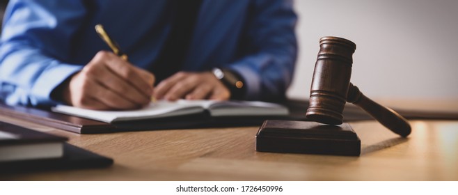 Male Lawyer Working At Table In Office, Focus On Gavel. Banner Design