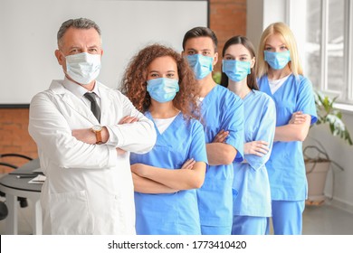 Male lecturer with medical students in university - Powered by Shutterstock