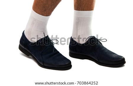 Male legs in shoes on a white background