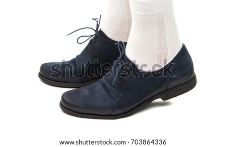 Male legs in shoes on a white background