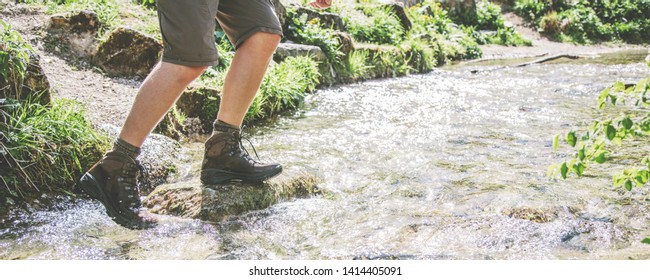 Male Legs, In Waterproof Sports Hiking Boots, Walking On Water(river)