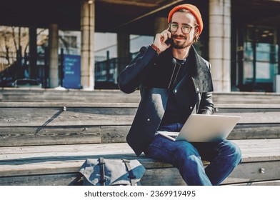  male looking at camera while communicate via cellular