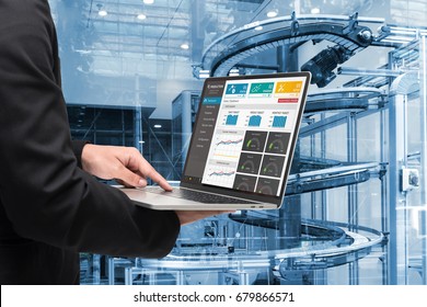 Male Manager Hand Laptop For Check Real Time Production Monitoring System Application In Smart Factory Industrial. Automated Conveyor Systems For Package Transfer Machine Industry 4.0 And Iot Concept.