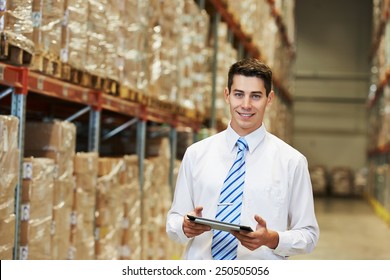 Male Manager Man Worker Standing In Big Modern Warehouse With Tablet Computer