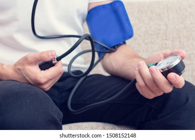 Male Measuring Blood Pressure, Man's Hands, Close Up