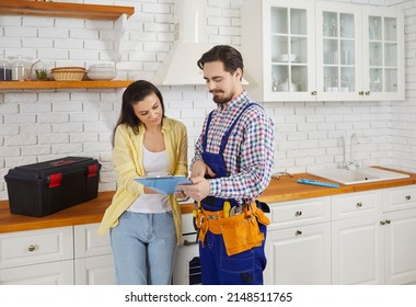 Male mechanic or repairman close deal with female client after work or fix at home. Man plumber or engineer get woman customer sign contract for repair. Plumbing and maintenance. - Shutterstock ID 2148511765