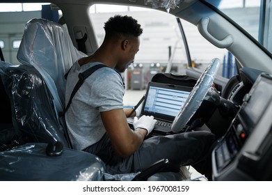 Male Mechanic Using Laptop, Car Service