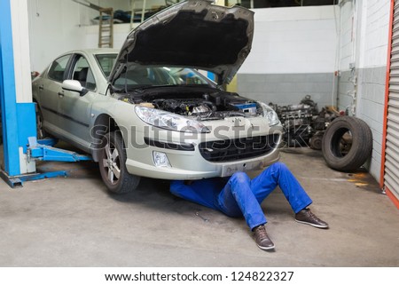 Similar – Image, Stock Photo Auto mechanic working in garage. Repair service.