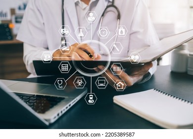 Male medicine doctor hand holding silver pen writing something on clipboard close up. Ward round, patient visit check, medical calculation and statistics concept. - Shutterstock ID 2205389587