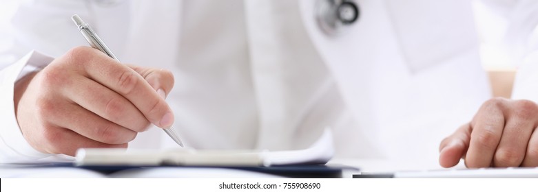 Male Medicine Doctor Hand Holding Silver Pen And Clipboard Pad Closeup. Ward Round Patient Visit Check Medical Calculation And Statistics Concept Physician Ready To Examine Patient