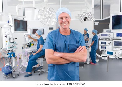 Male Member Of Surgical Team In Hospital Operating Room Smiling At Camera