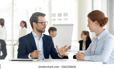 Male Mentor Insurance Broker Or Bank Manager Consulting Client Making Business Offer At Meeting, Salesman Insurer Speaking Sell Services Talking With Customer Explaining Loan Deal Benefits In Office