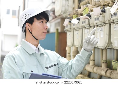 Male Meter Reader In Work Clothes