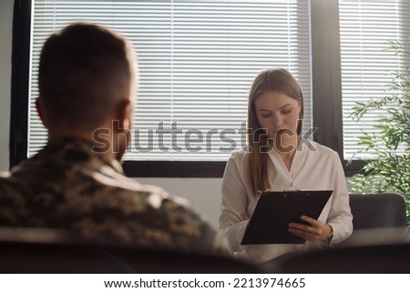 Male military officer having appointment with psychotherapist in office