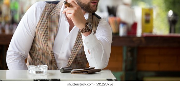 Male Model With A Cigar In A Bar