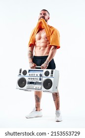 Male Model, Muscular, Strong Man, Posing With An Old School Radio, An Aggressive Expression, Showing His Strength.