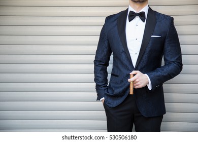 Male Model In A Suit With A Cigar