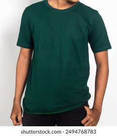 Male model wearing plain green t-shirt mockup. Man in stylish t-shirt isolated on white background. T-shirt mock up