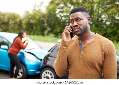 Male Motorist Involved In Car Accident Calling Insurance Company Or Recovery Service - Shutterstock ID 1426522856