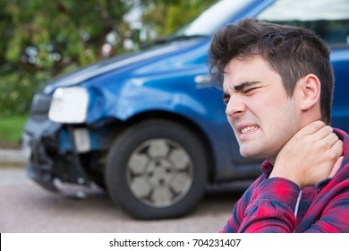 Male Motorist Suffering From Whiplash After Car Accident