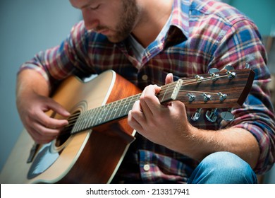 Male Musician Playing Acoustic Guitar