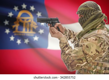 Male in muslim keffiyeh with gun in hand and flag on background series - Georgia