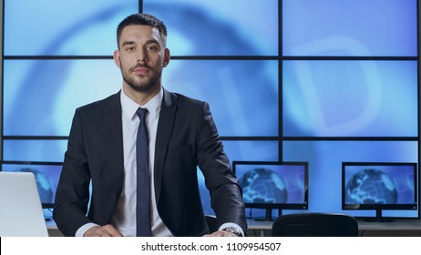 Male News Presenter In Broadcasting Studio.