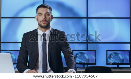 Male News Presenter in Broadcasting Studio.