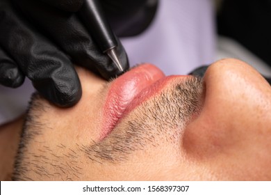 Male NU Lips. Young man closeup lips, male permanent make up, men's bristle.