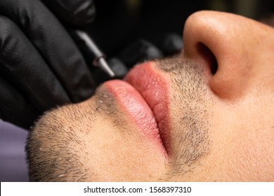 Male NU Lips. Young man closeup lips, male permanent make up, men's bristle.