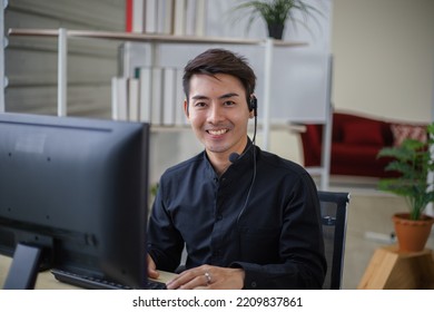 Male officer working and smiling in customer service office. - Shutterstock ID 2209837861