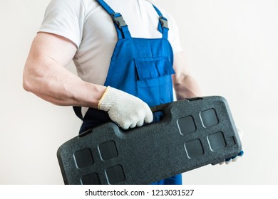 male in overalls plumber, electrician, with tools, home repair, husband for an hour