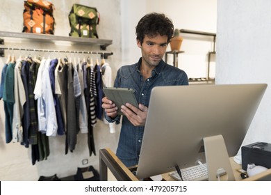 Male Owner Of Fashion Store With Digital Tablet Computer