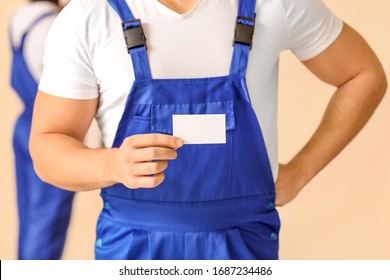 Male Painter With Business Card In Room, Closeup