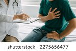 Male patient consulting a medical specialist at hospital. Chest pain and inflammatory heart disease