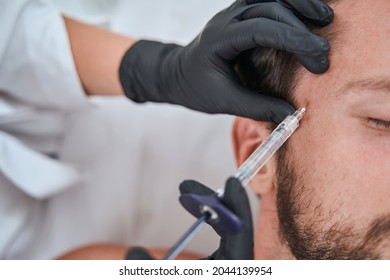 Male Patient Getting A Face Filler Injection