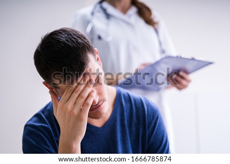 Male Patient With Headache In A Clinic